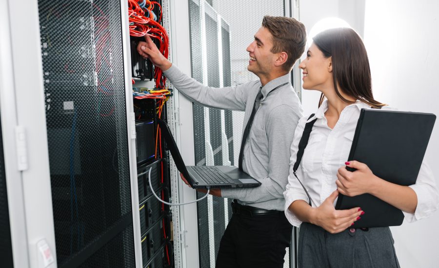 Team OF Young Business People IT Engineer IN Network Server Room Solving Problems AND Give Help AND Support
